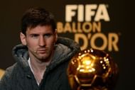 Argentina's Lionel Messi looks at the Ballon d'Or trophy on January 7, 2013 in Zurich